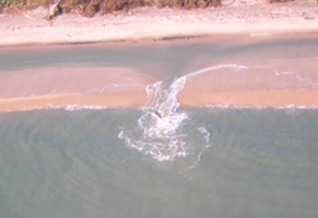 Image showing rip currents developed by bar trough channel flow